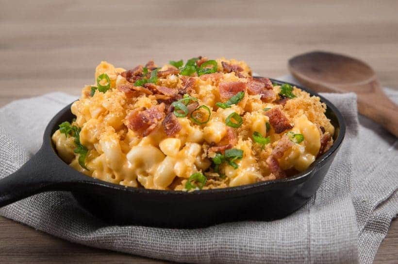 Loaded Instant Pot Mac and Cheese Recipe: Piping hot elbow macaroni swimming in creamy cheddar cheese sauce. Sprinkled with buttery toasted golden breadcrumbs, smoky crispy bacon bits, and crunchy scallions. Indulge in this ultimate kid-friendly comfort food.