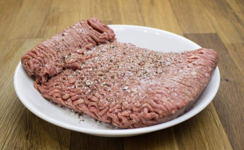 season ground beef with kosher salt and black pepper