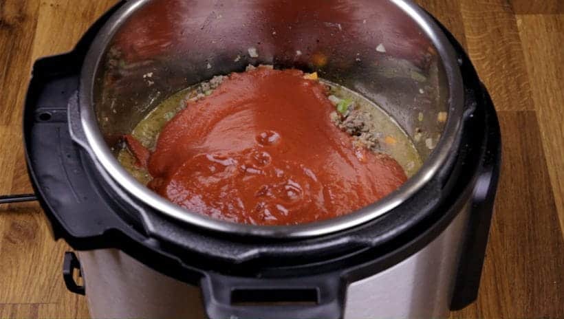 Instant Pot Pasta Sauce Recipe: add crushed tomatoes