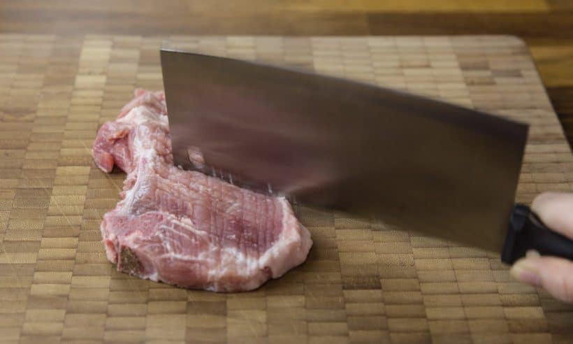 Instant Pot Pork Chops in HK Mushroom Gravy Recipe: tenderizing the pork chops with back-end of a heavy knife