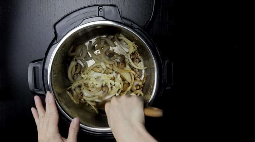 Make Umami Instant Pot Beef Stroganoff Recipe (Pressure Cooker Beef Stroganoff): saute onions and garlic in Instant Pot Pressure Cooker