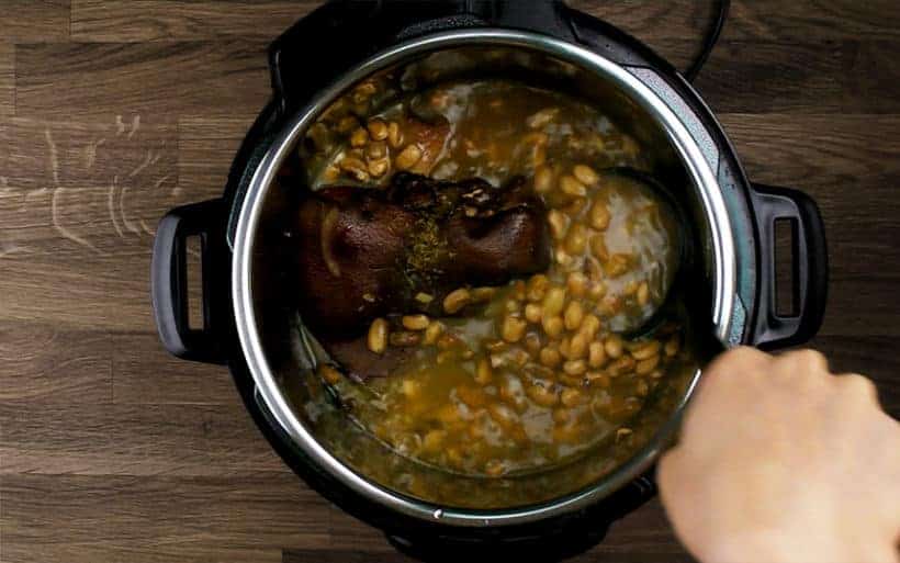 Instant Pot Ham and Bean Soup Recipe (Pressure Cooker Ham and Bean Soup): thicken soup by giving a few quick stirs with wooden spoon. Taste and season with kosher salt.