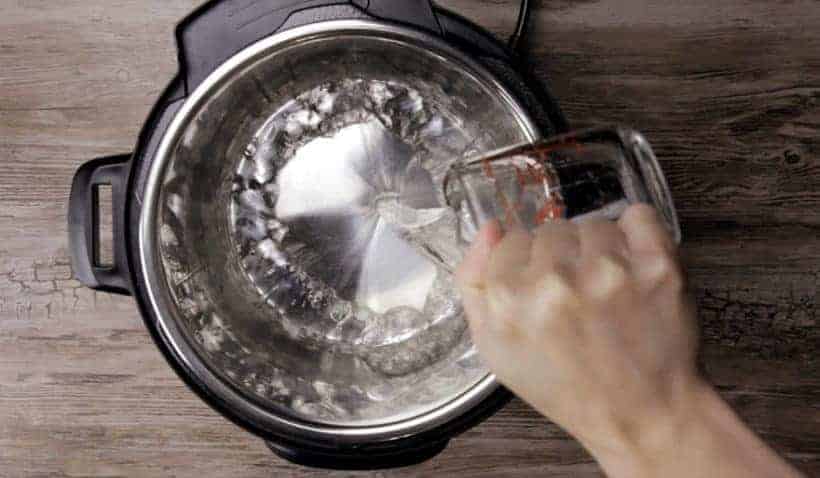 Instant Pot Dulce De Leche Recipe (Pressure Cooker Dulce De Leche): add water into Instant Pot Electric Pressure Cooker