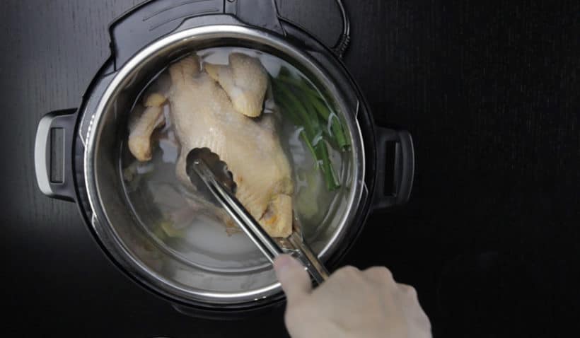 Instant Pot HK Chicken Recipe (Pressure Cooker Chicken) - Cantonese Poached Whole Chicken White Cut Chicken 白切雞: submerge whole chicken in the water in Instant Pot Electric Pressure Cooker