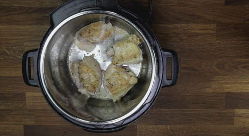 Quick & Easy Instant Pot Garlic Butter Chicken Recipe (Pressure Cooker Garlic Butter Chicken): flip and brown the meat side of chicken thighs in Instant Pot