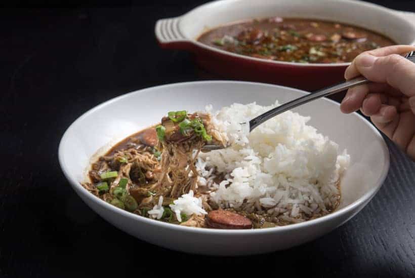 Make Mouthwatering Louisiana Instant Pot Gumbo Recipe (Pressure Cooker Gumbo): a hearty Southern pot of love packed with smoky-spicy Cajun, Creole flavors and rich aromas. Feed your crowd with this delicious party favorite - not just for Mardi Gras! #instantpot #instantpotrecipes #gumbo #pressurecooker #pressurecookerrecipes