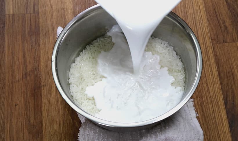 Instant Pot Mango Sticky Rice Recipe (Pressure Cooker Thai Mango Sticky Rice): mix coconut milk mixture with pressure cooker glutinous rice