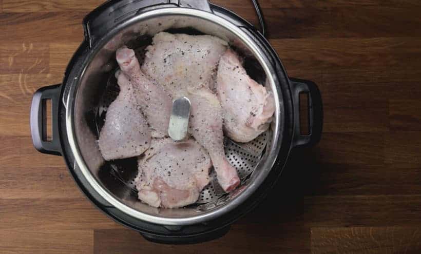 Instant Pot BBQ Chicken Recipe (Pressure Cooker BBQ Chicken): add chicken in Instant Pot on steamer basket