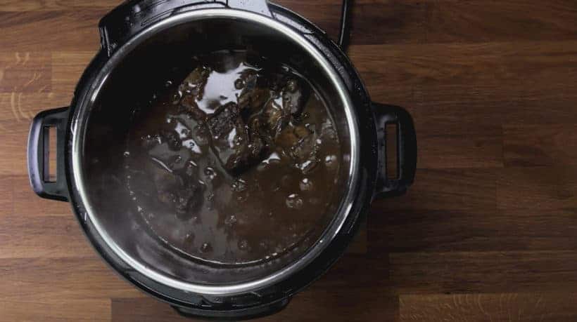 Instant Pot Short Ribs (Pressure Cooker Short Ribs): place pressure cooked short ribs back in Instant Pot Red Wine Sauce 