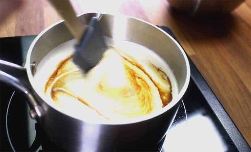 warm heavy cream mixture in saucepan