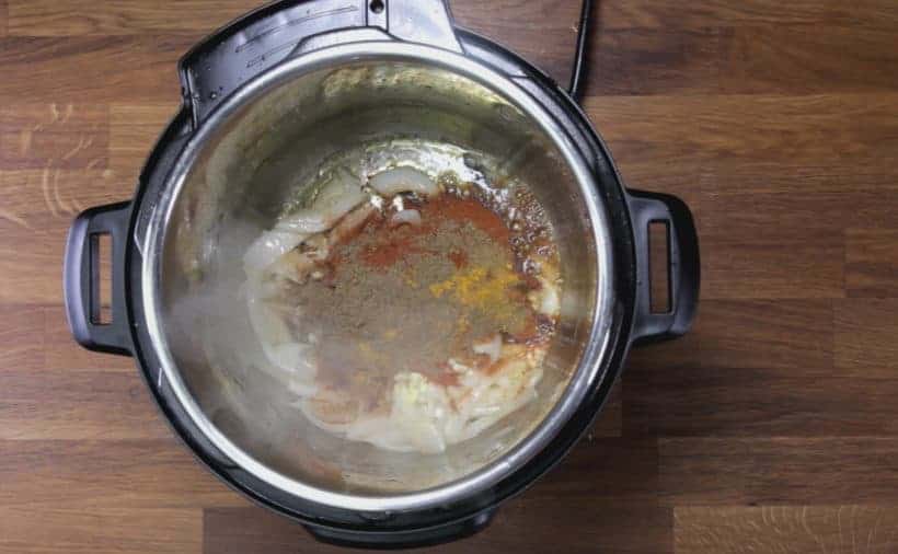 Instant Pot Butter Chicken: saute ginger, garlic, garam masala, sugar, paprika, tumeric, coriander, cumin in Instant Pot Pressure Cooker