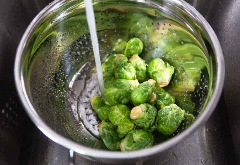 Instant Pot Brussels Sprouts: rinse and clean brussels sprouts with cold water 