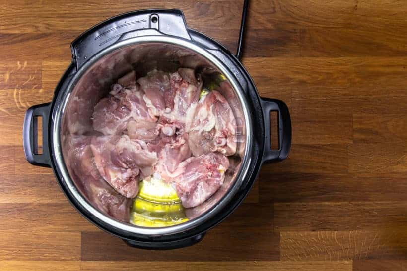 Instant Pot Butter Chicken: brown chicken thighs in Instant Pot Pressure Cooker