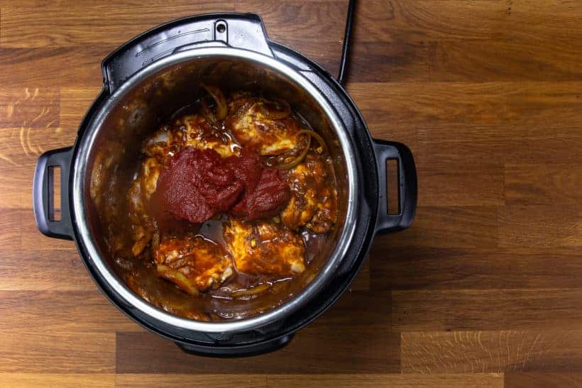 Instant Pot Butter Chicken: layer tomato paste in Instant Pot Pressure Cooker