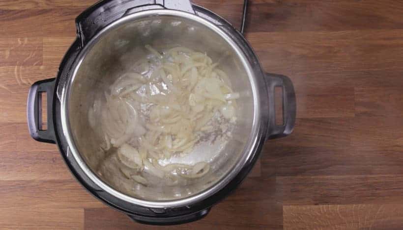 Instant Pot HK Onion Chicken: saute onions and garlic in Instant Pot Pressure Cooker