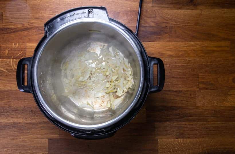 Instant Pot Orange Chicken: saute garlic in Instant Pot Pressure Cooker