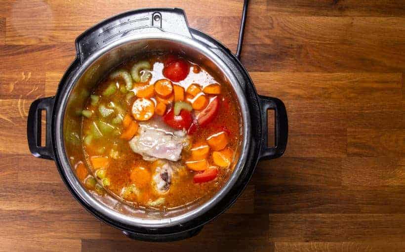 Instant Pot Chicken Soup | Pressure Cooker Chicken Soup: add chicken, celery, carrot, tomatoes, chicken stock in Instant Pot