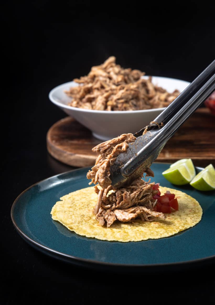 Instant Pot Chicken Tacos | Pressure Cooker Chicken Tacos: add shredded chicken, salsa pico de gallo, toppings on tortillas